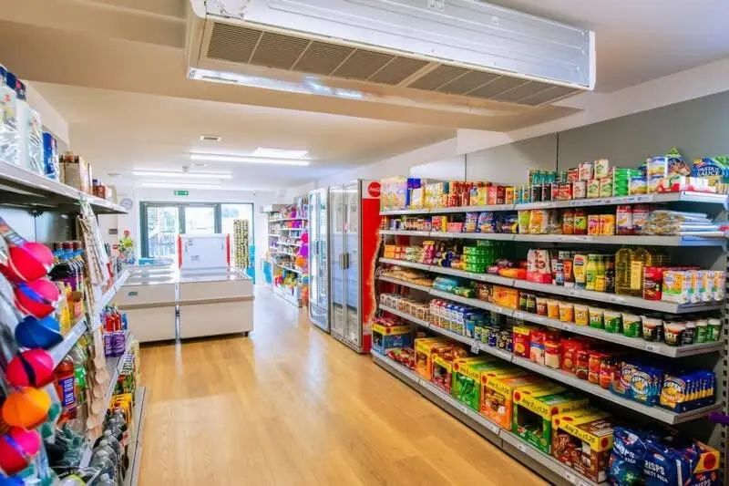 an empty aisle of a grocery store with food at 36 Lighthouse View in Lossiemouth