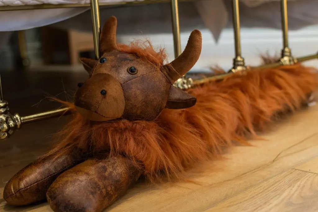 a stuffed animal animal is laying on a table at Bridgend Bothy in Drumnadrochit
