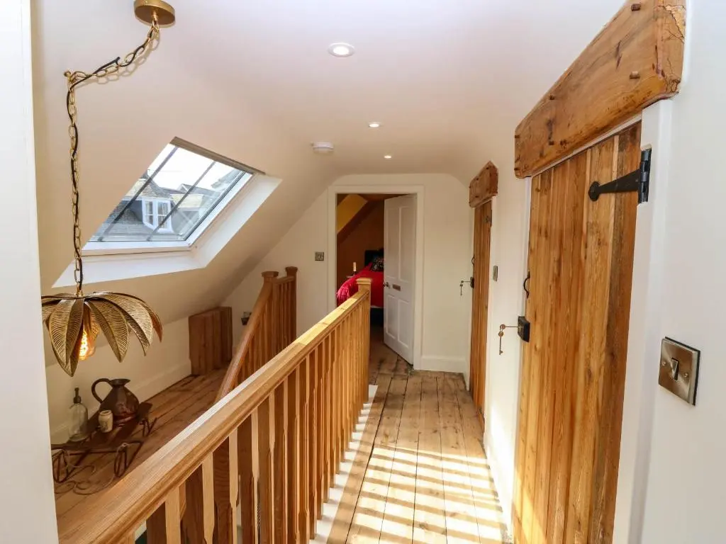 a hallway with stairs and a skylight at Evansford in Ballater