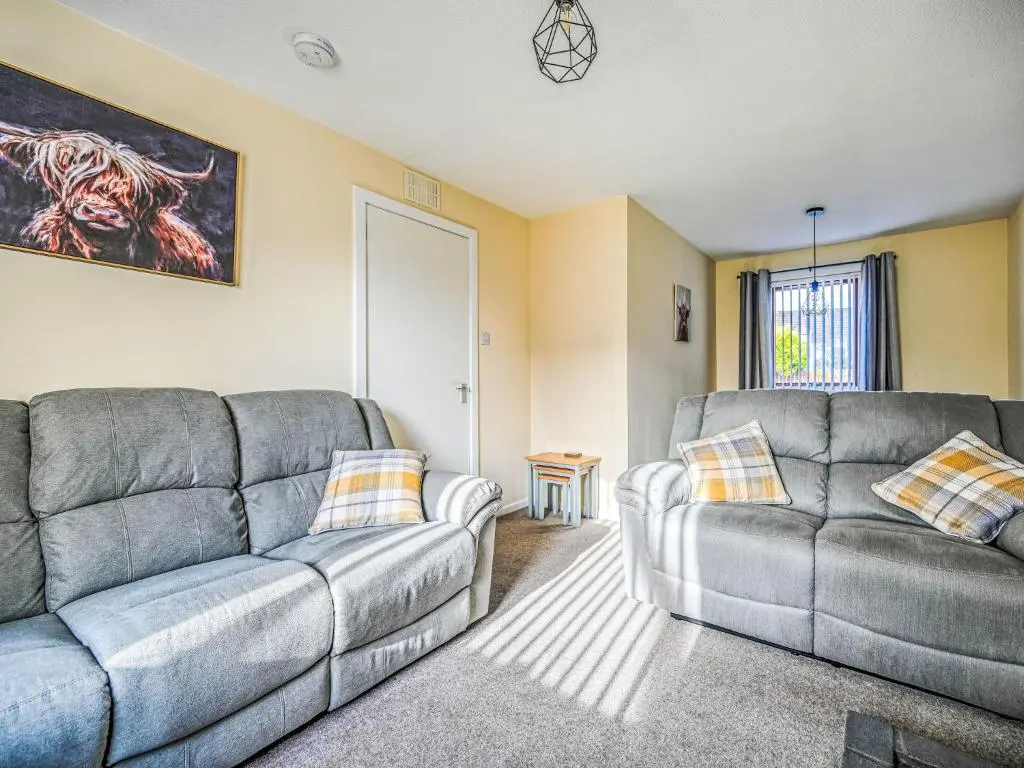 a living room with two couches and a couch at Holiday Home Appletree by Interhome in Muir of Ord