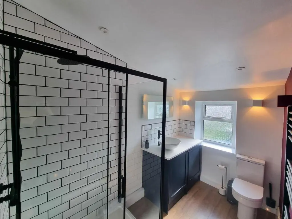 a bathroom with a sink and a toilet at West Lodge, High Street in Aberlour