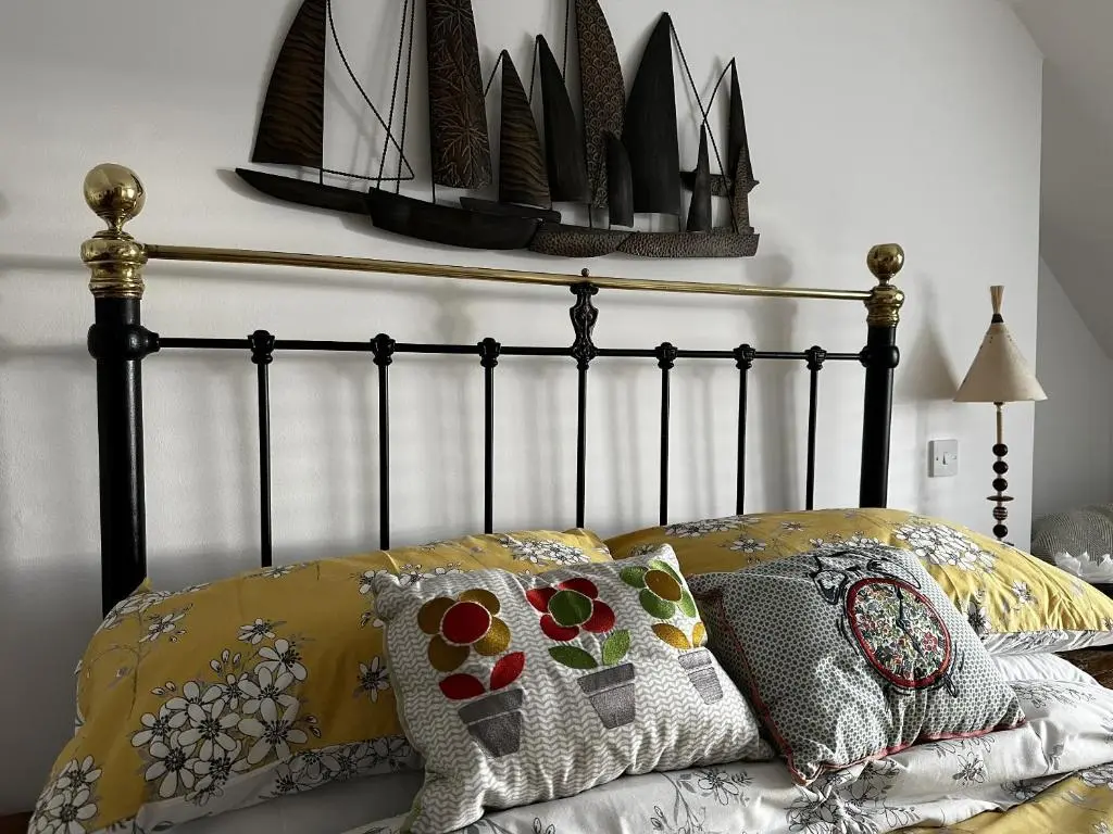 a bed with two pillows on it with at Sealladh Sona in Inverness