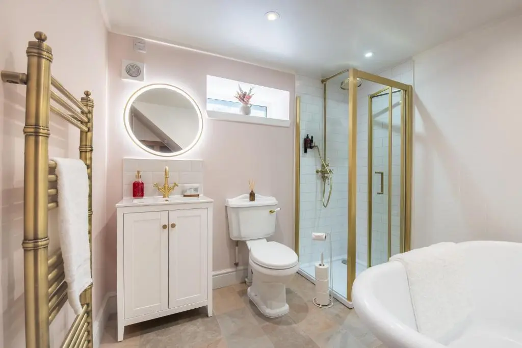 a bathroom with a toilet and a sink and a shower at Keel Cottage & Dog Friendly in Nairn