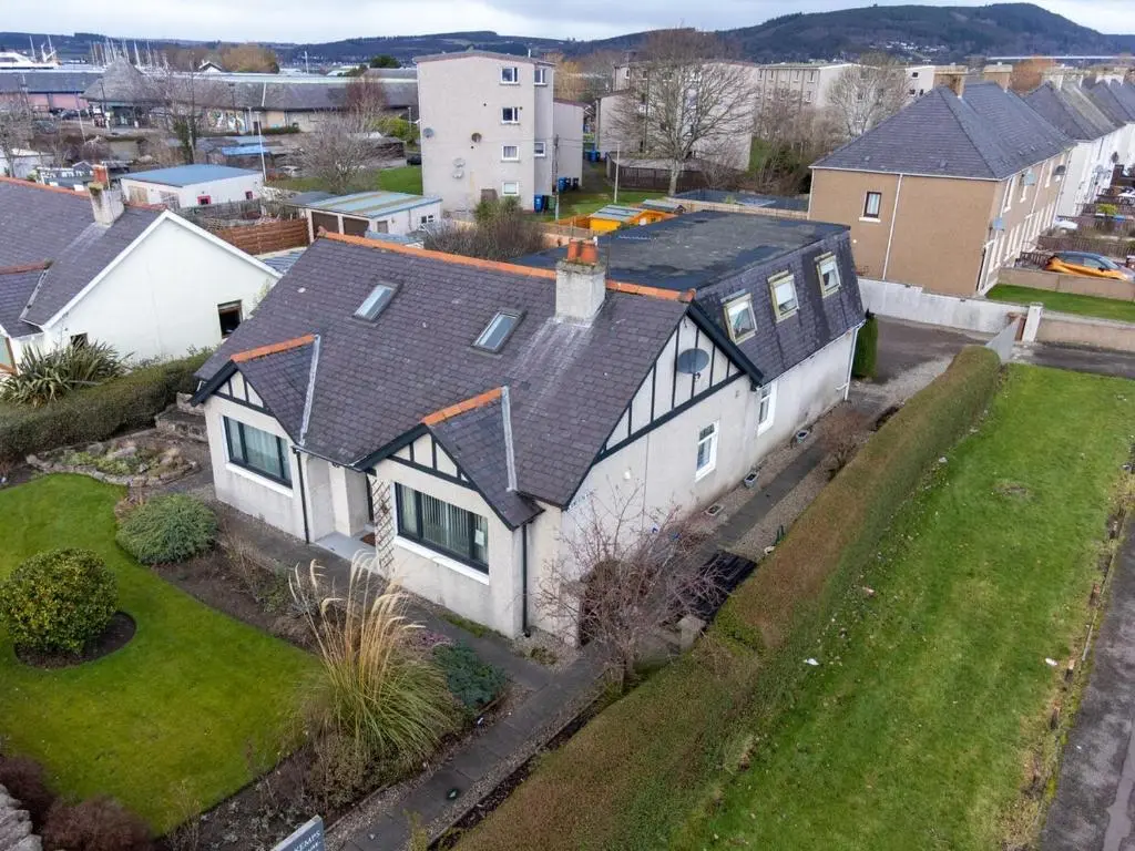 an aerial view of a white house with a roof at THE KEMPS 7bed 6 bathroom PARKING for 3 vehicles Ideal for contractors Next to LIDLE part of Langleycottageandapartments portfolio REDUCTION FOR LONG STAYS in Inverness