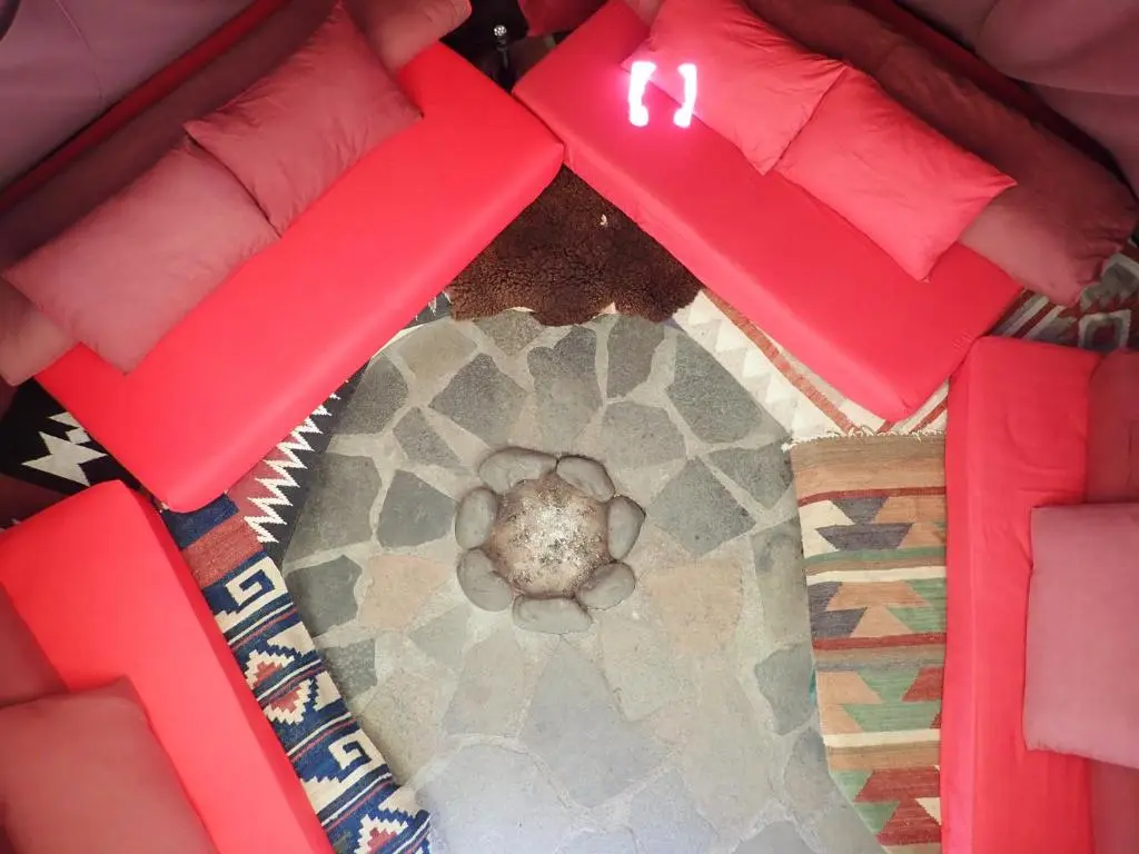 a view of a room with a dog in the middle at Private Speyside Tipi Retreat and Whisky Marrying Tun Hot Tub in Coltfield