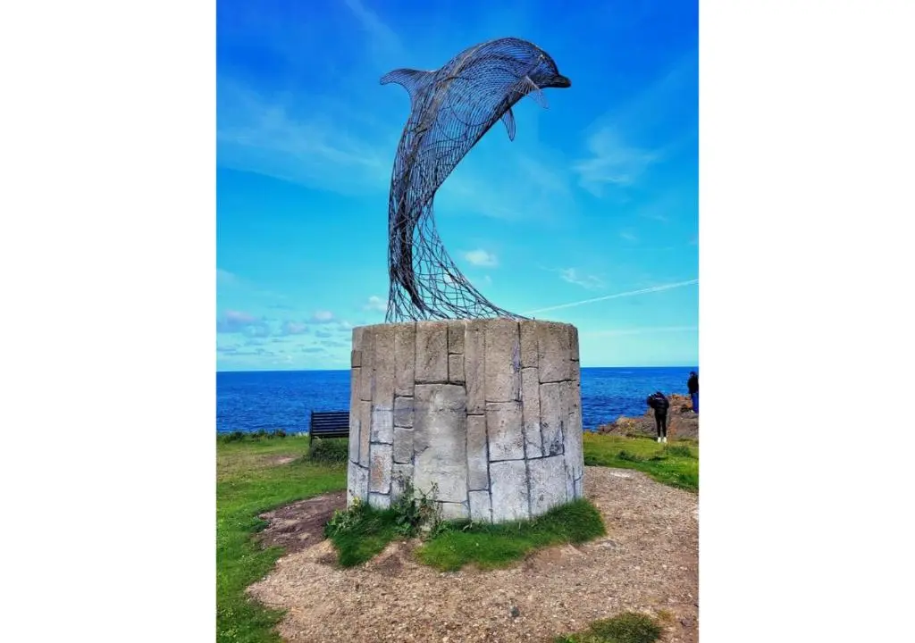 a statue of a fish on a rock at House By The Sea in Portsoy
