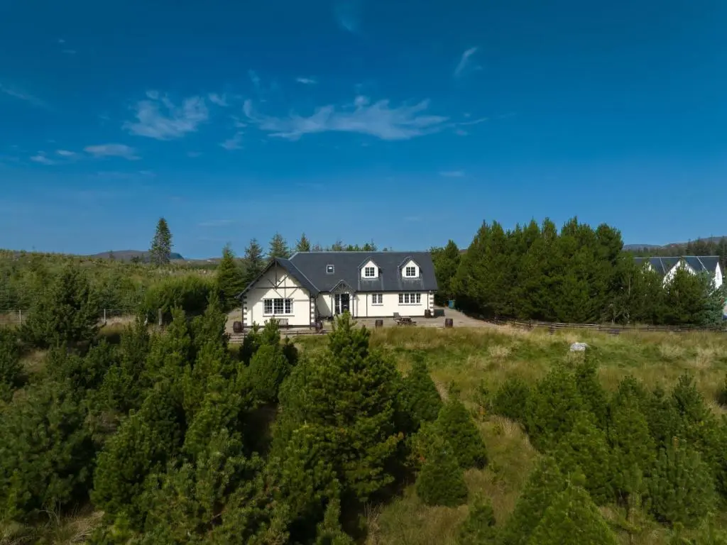 an aerial view of a house in a field at Holiday Home Mountain View Lodge by Interhome in Whitebridge