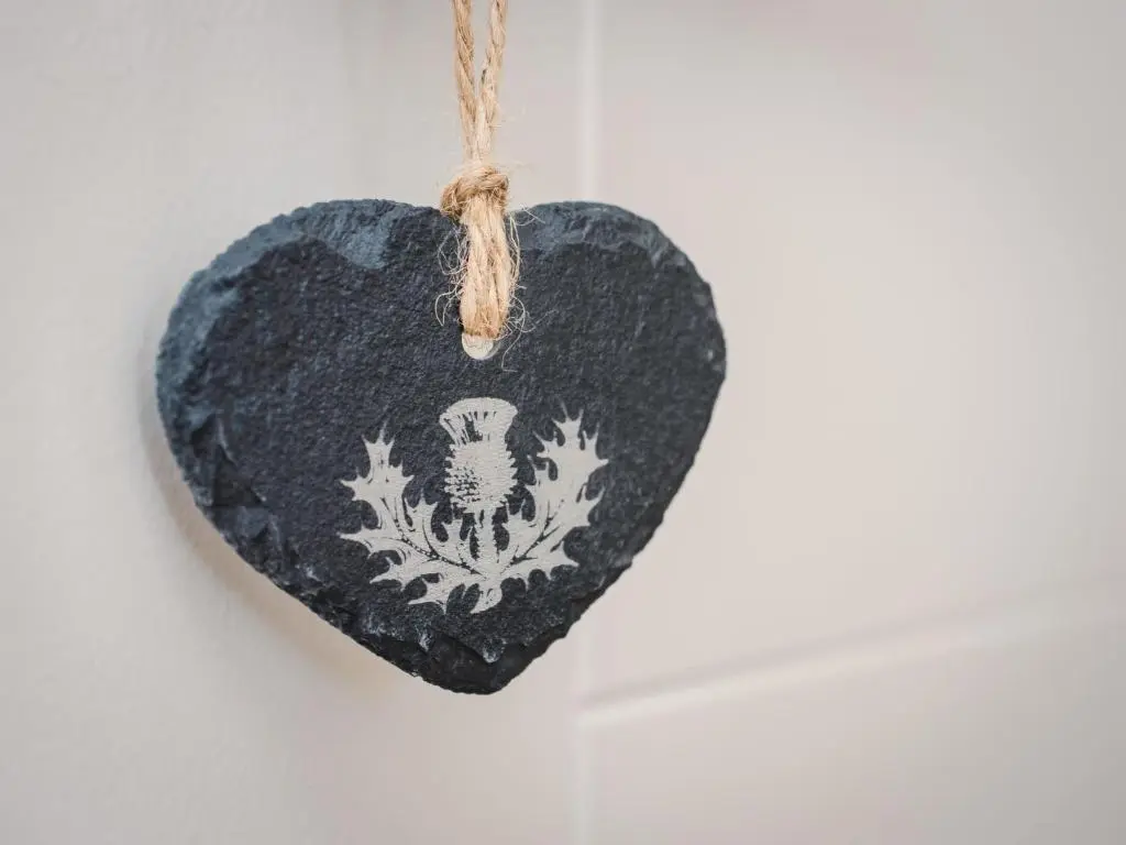 a black heart ornament hanging on a wall at Apartment Great Glen View by Interhome in Inverness