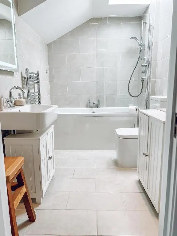 a bathroom with a tub and a sink and a toilet at River-View Loft, sleeps 4, with parking in Inverness