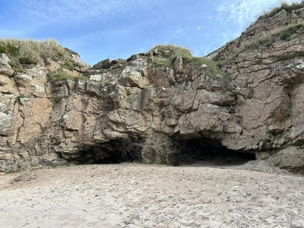 a cave in the side of a rocky cliff at A13 - Beach Haven at Silversands in Lossiemouth