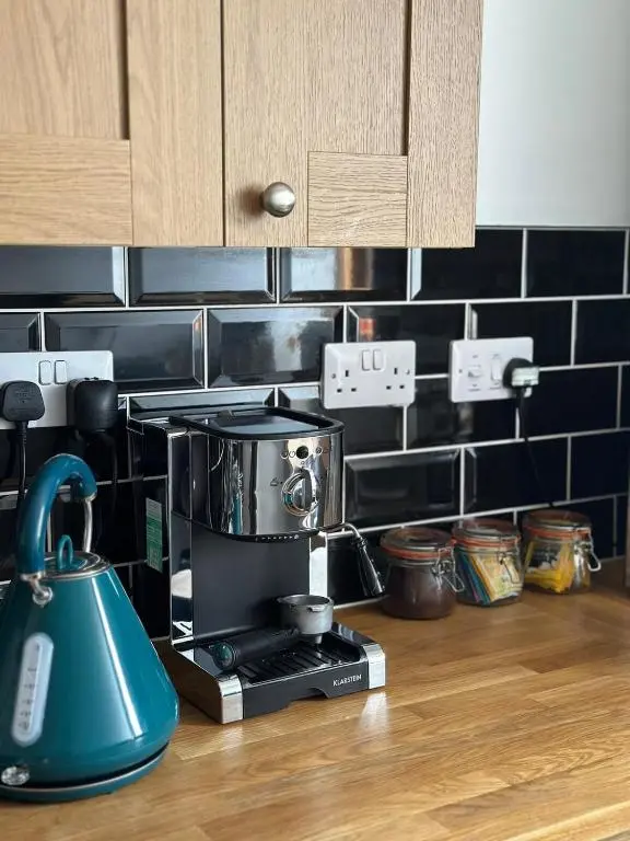 a coffee maker on a counter in a kitchen at Serendipity The Apartment in South Kessock