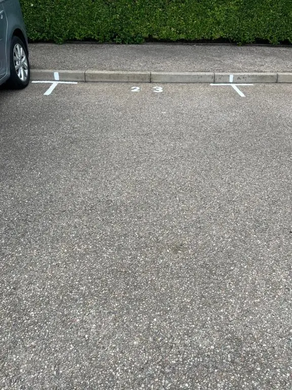a parking lot with a car parked on the street at Covesea Horizon in Elgin