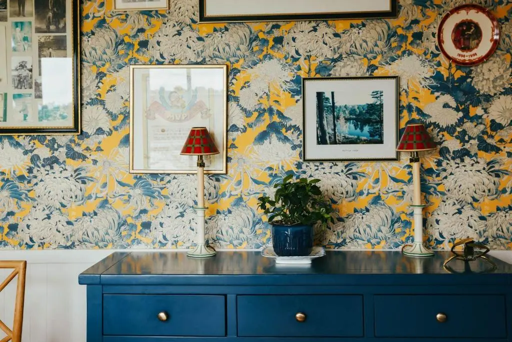 a room with a blue dresser with two lamps on it at The Secret Loch in Lhanbryd