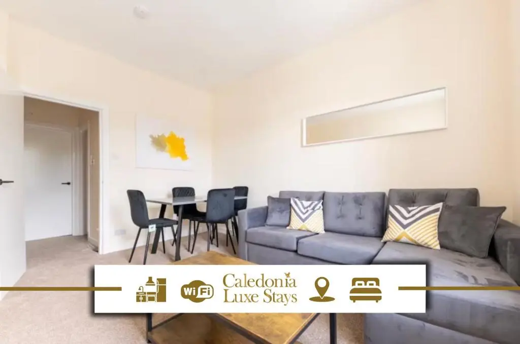 a living room with a couch and a table at 1 BDR Apt By Caledonia Luxe Stays Short Lets & Serviced Accommodation Inverness in Inverness