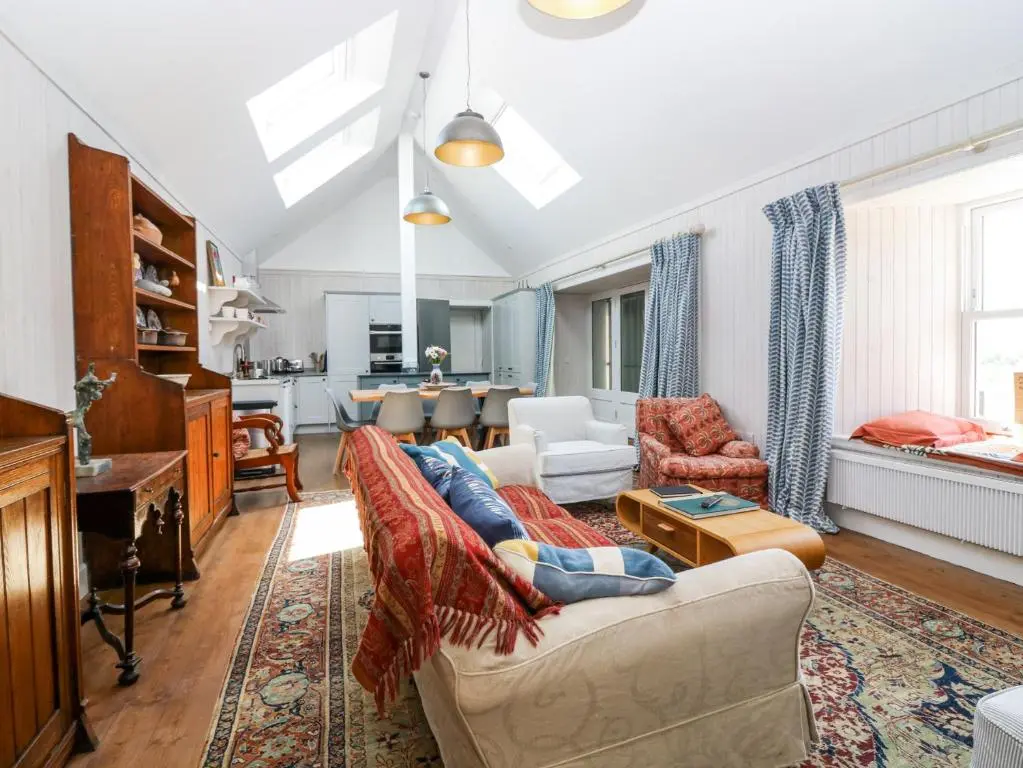 a living room with a couch and a table at The Crannach in Blairgowrie