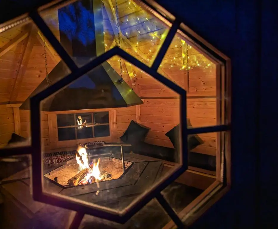 a view of a fireplace from a window at Logies Croft in Kellas