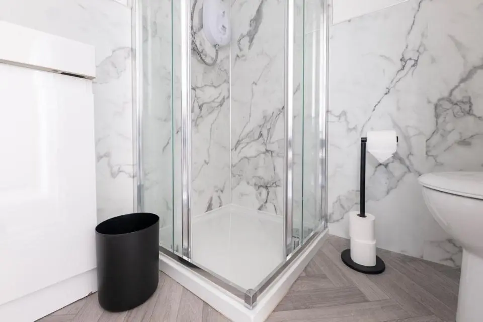 a bathroom with a glass shower and a toilet at 1 BDR Apartment At Caledonia Luxe Stays Short Lets & Serviced Accommodation Inverness in Inverness