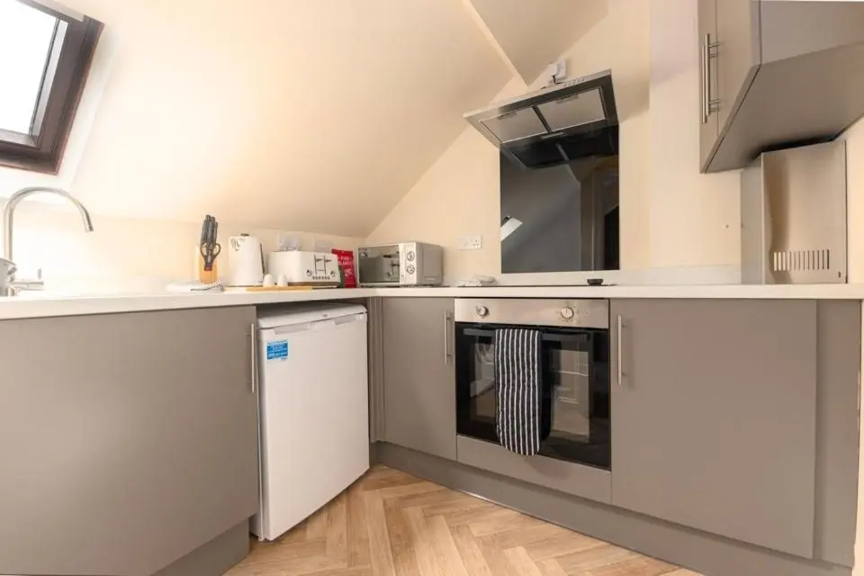 a kitchen with a sink and a dishwasher at 2 BDR Apt At Caledonia Luxe Stays Short Lets & Serviced Accommodation Inverness in Inverness