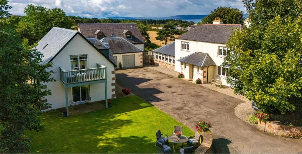 an aerial view of a house with a yard at Sandown House in Nairn