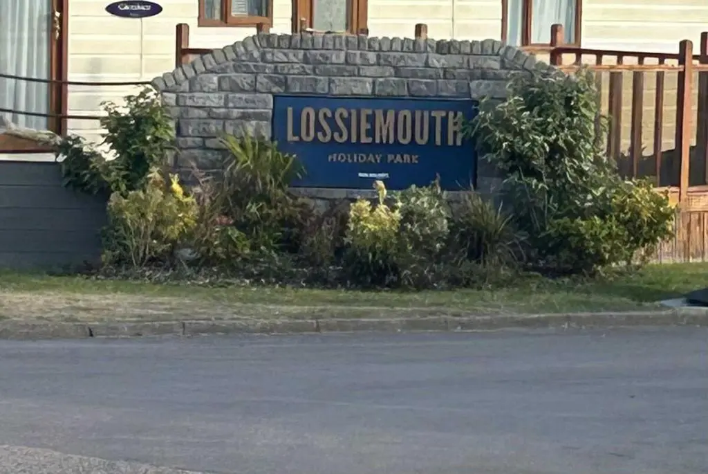 a sign for a house in front of a building at Parkview holiday lodge in Lossiemouth