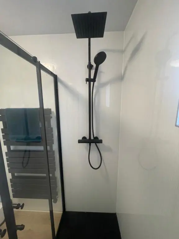 a room with a floor lamp and a mirror at 51 Island Bank in Inverness