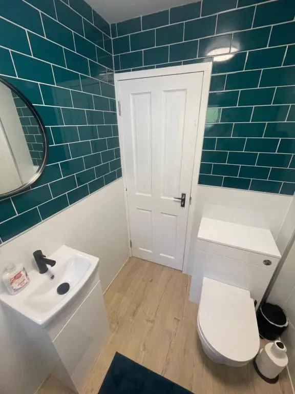 a bathroom with a white toilet and a sink at 51 Island Bank in Inverness