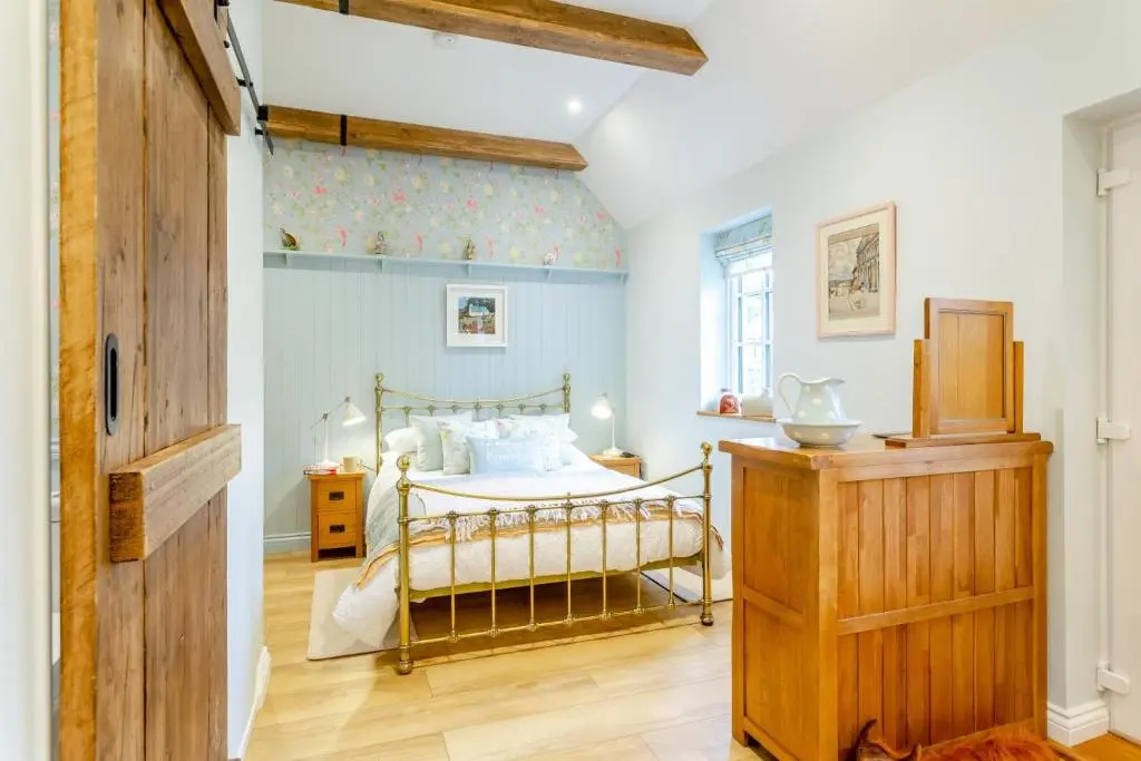 a bedroom with a bed in the corner of a room at 1 Bed in Drumnadrochit oc-t32404 in Drumnadrochit