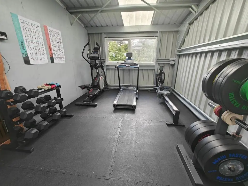 a gym with weights and equipment in a room at 1 Bed in Newtonmore oc-c32414 in Newtonmore