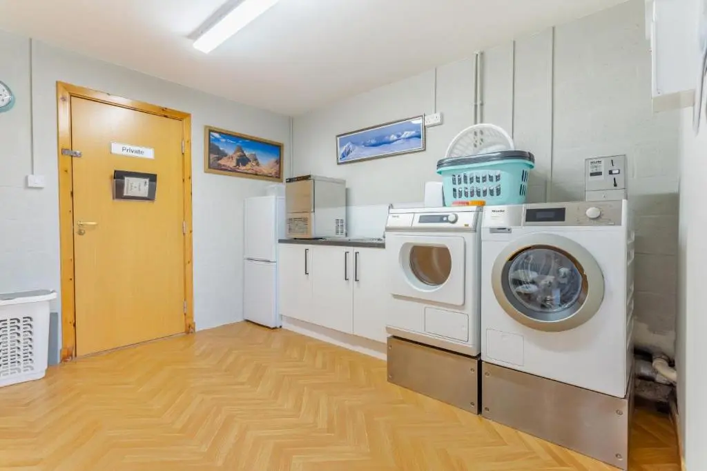 a laundry room with a washer and dryer in it at 1 Bed in Newtonmore oc-l32415 in Newtonmore