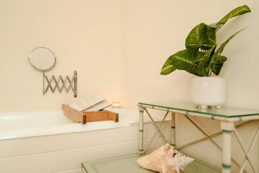 a room with a table and a potted plant at Glencarnie - Seasgair Lodges in Boat of Garten
