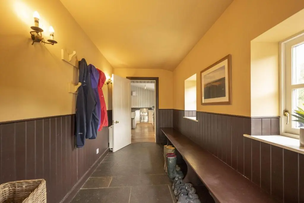 a hallway with a long bench in a house at Laggandhu in Nethy Bridge