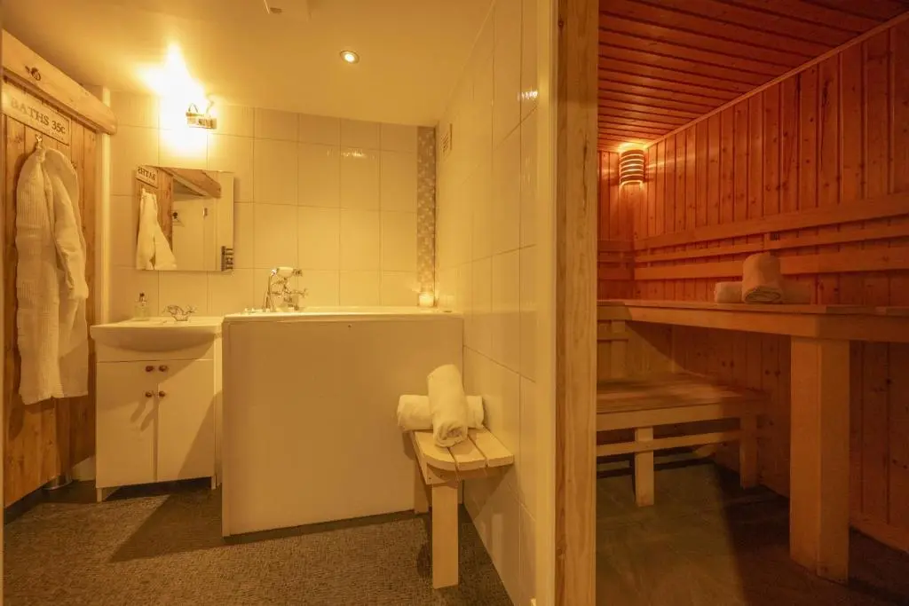 a bathroom with a tub and a sink and a toilet at Craggan Mill in Grantown on Spey