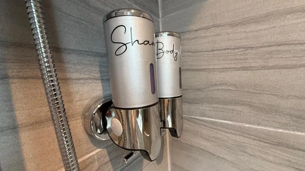 a silver door handle on a wooden door at The Bakehouse - by Caithness Luxury Apartments NC500 - 5 Bedroom Luxury Holiday Home - Sleeps Work teams upto 5 & holiday makers upto 10 in Wick