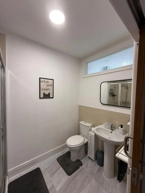 a bathroom with a toilet and a sink at The Willows in Nairn