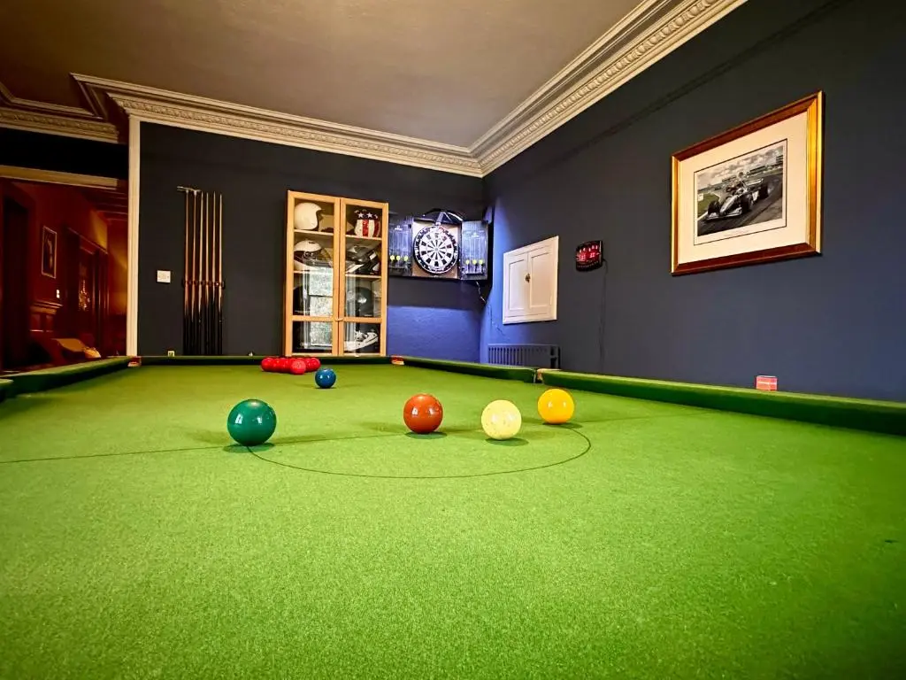 a room with a pool table with balls on it at Clashmore House in Dornoch