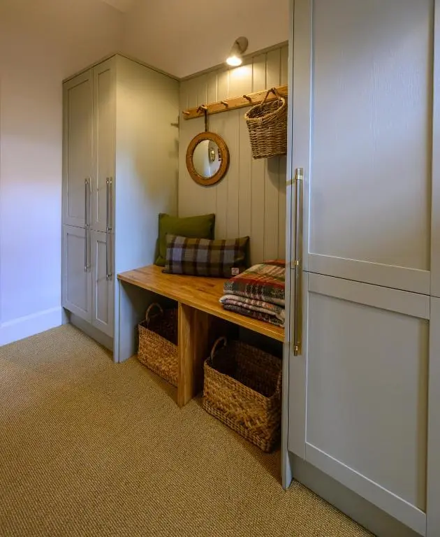 a small room with a table and a refrigerator at Harris House in Inverness