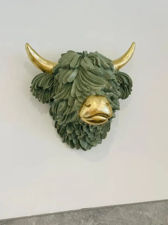 a head of a bull with horns on a wall at V\u016b by the Bridge, Inverness City Centre in Inverness