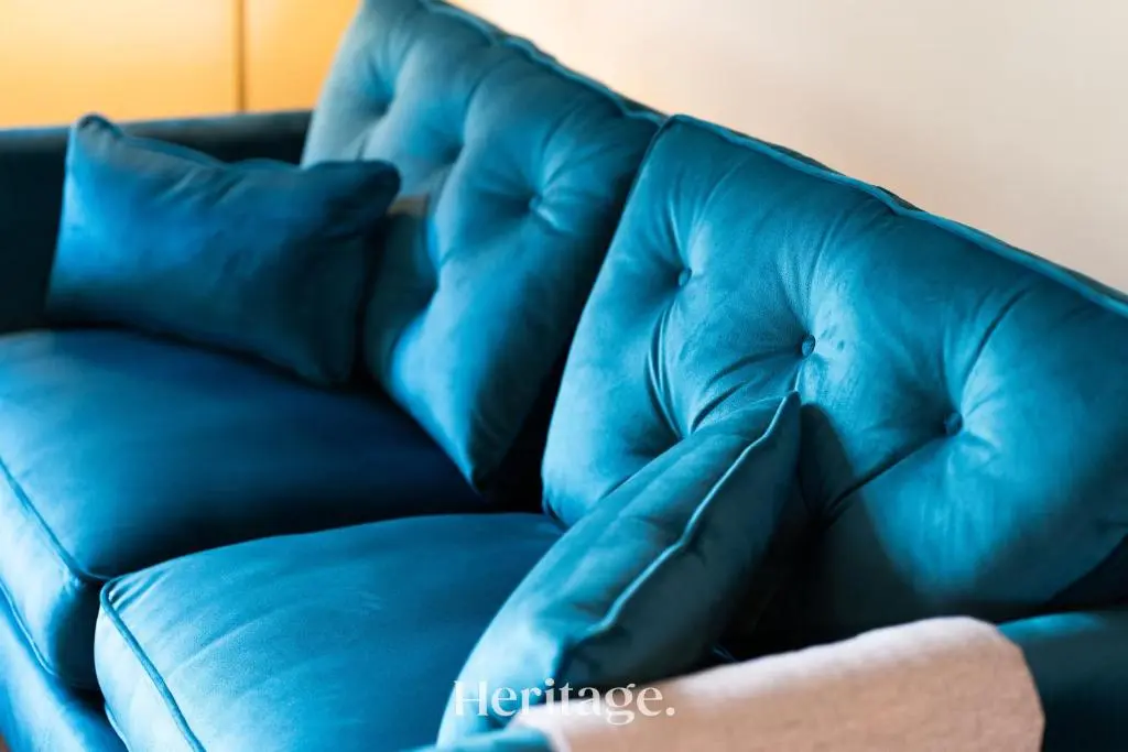 a blue leather couch sitting in a living room at Woodside, Get away with Hot Tub, near Fraserburgh in Strichen