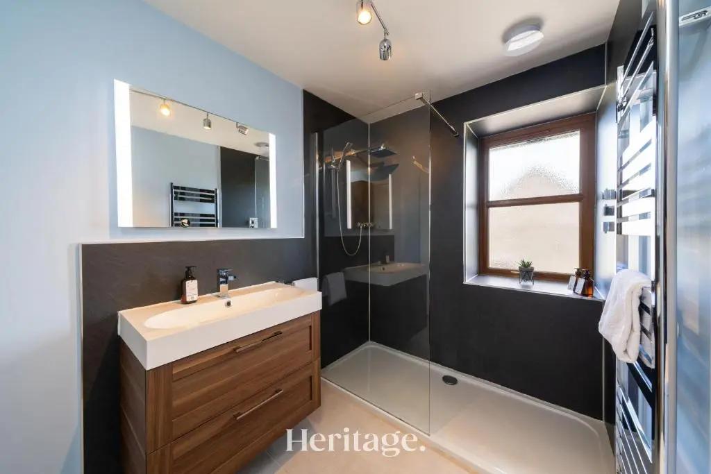 a bathroom with a sink and a shower at Woodside, Get away with Hot Tub, near Fraserburgh in Strichen