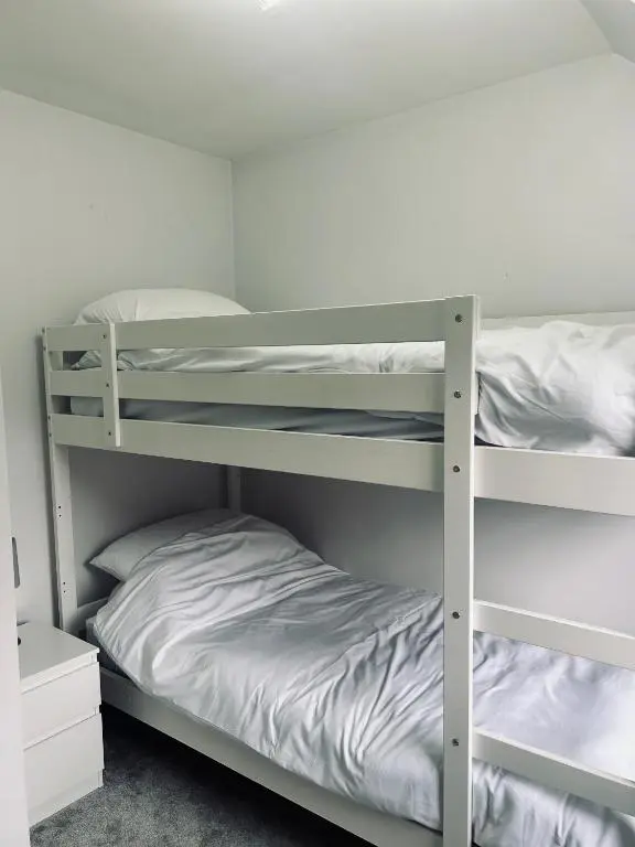 a bunk bed room with two bunk beds at 6 Carn Dearg House in Aviemore