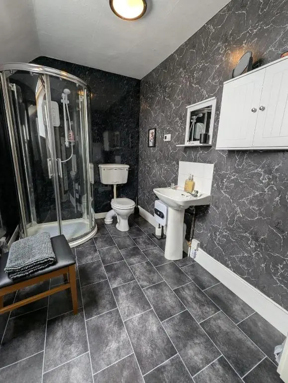 a bathroom with a shower and a toilet and a sink at Foggiehoose based near Turriff Huntly Banff in Aberchirder
