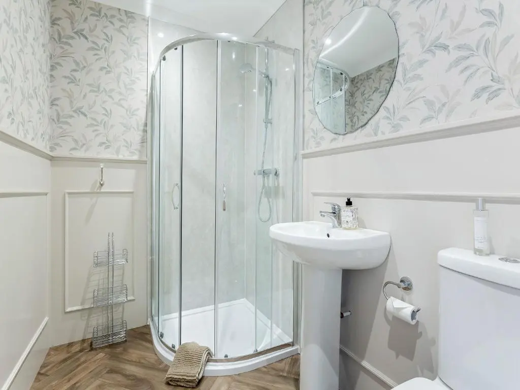 a bathroom with a shower and a sink at Sea Breezes in Balintore