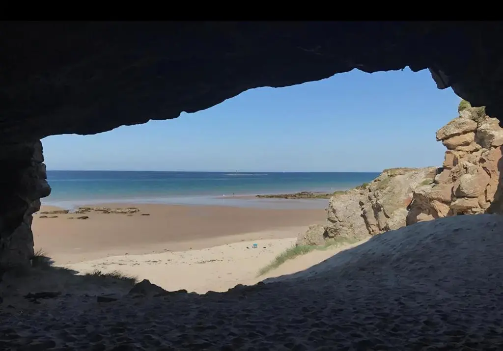 a view of a beach from inside a cave at Cladach in Lossiemouth