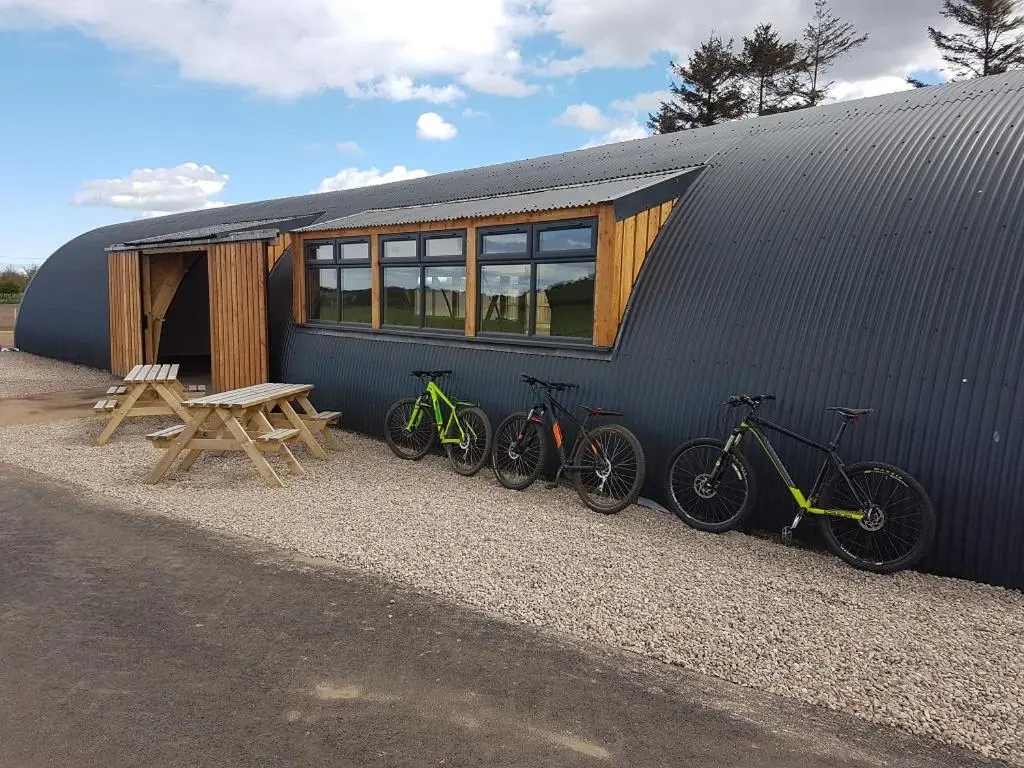 a group of bikes parked next to a building at The Loft Glamping & Camping in Kinloss