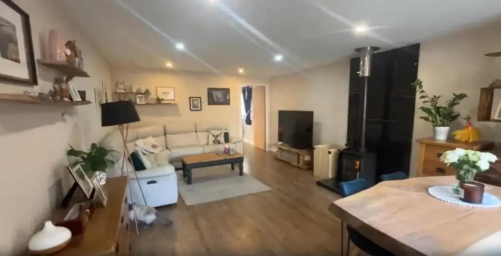a living room with a couch and a table at White Crystal in Invergordon