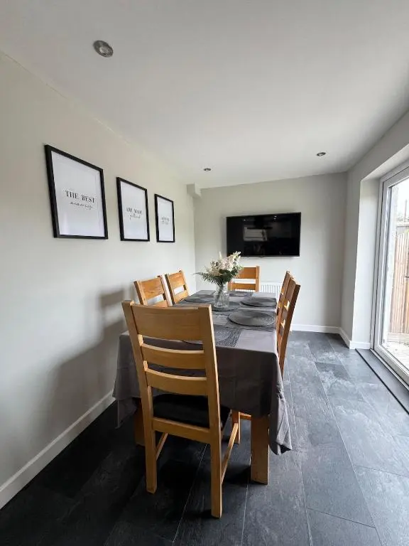 a dining room with a table and chairs at Inward Oasis Relax and unwind in Buckie