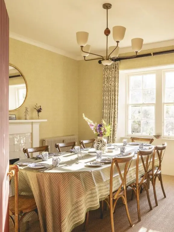 a dining room with a table and chairs at Lairg Lodge in Lairg