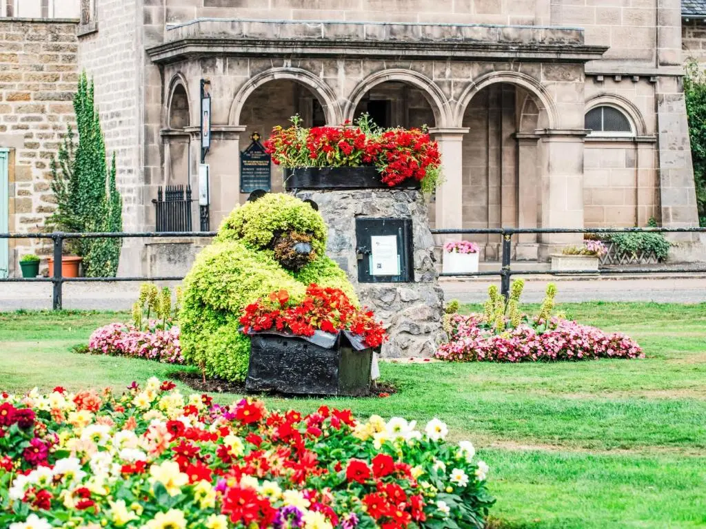 a flower garden in front of a building with flowers at Apartment Varis Haven by Interhome in Forres