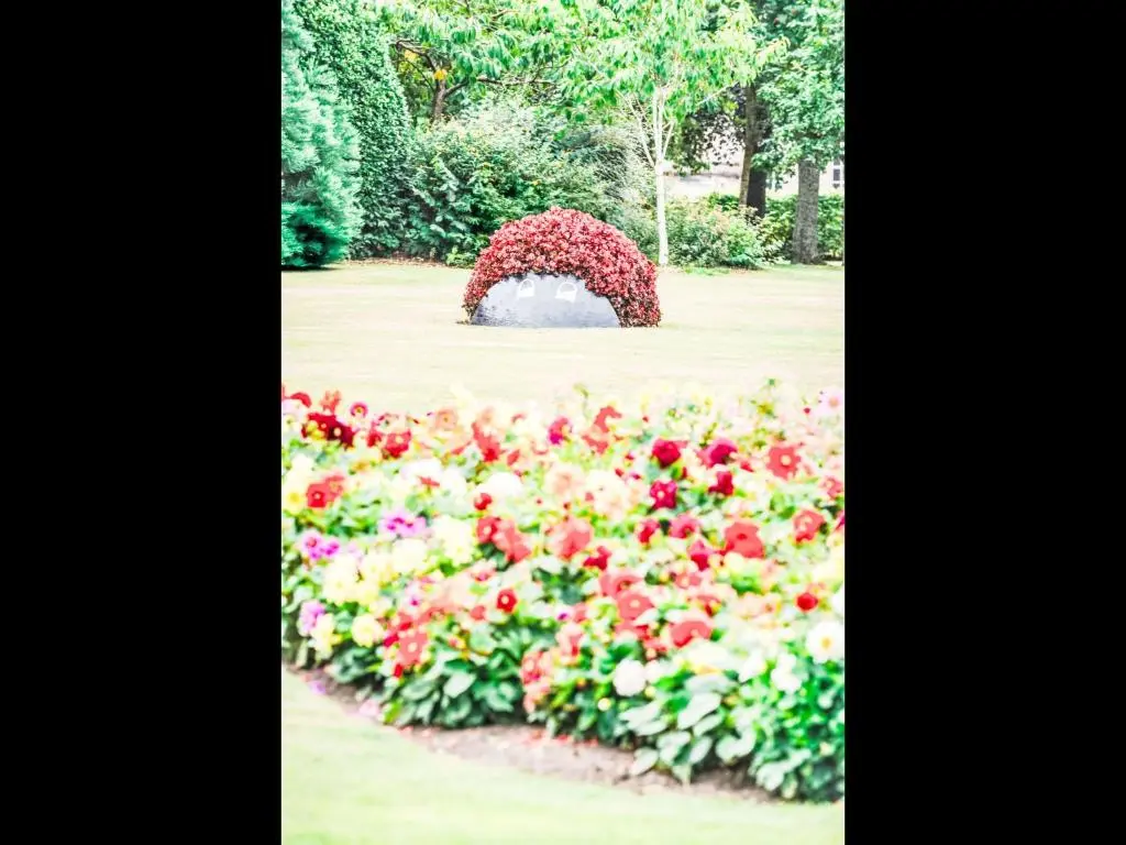 a floral arch in a field of flowers at Apartment Varis Haven by Interhome in Forres