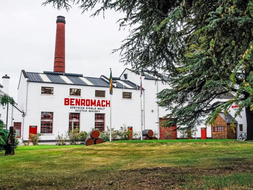 a white building with a chimney and a sign on it at Apartment Varis Haven by Interhome in Forres